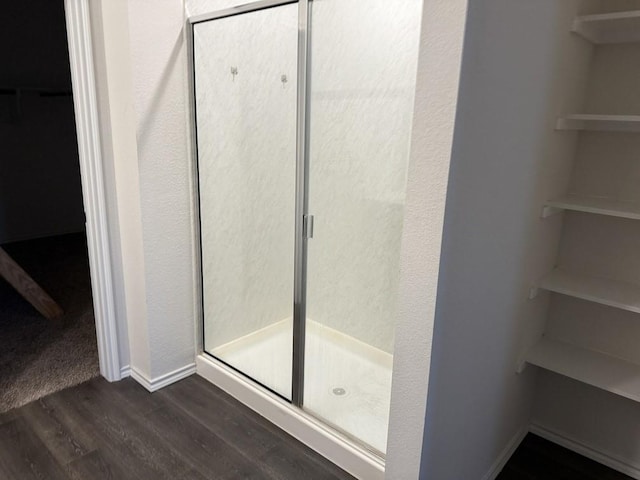 312 Wagon Wheel Dr, Josephine, TX 75189 - full bath featuring a walk in closet, a stall shower, and wood finished floors