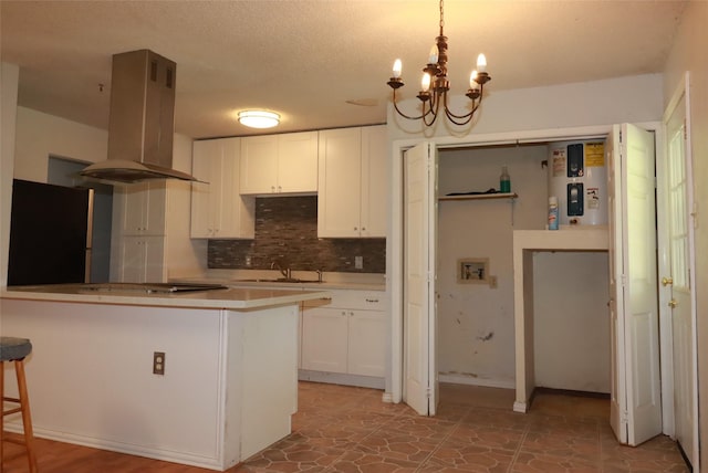 517 Annapolis Dr, Fort Worth, TX 76108 - kitchen featuring island range hood, freestanding refrigerator, white cabinets, and backsplash