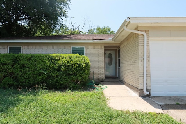 517 Annapolis Dr, Fort Worth, TX 76108 - view of exterior entry with brick siding and an attached garage
