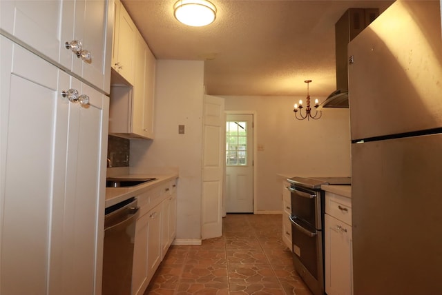 517 Annapolis Dr, Fort Worth, TX 76108 - kitchen with stainless steel appliances, island exhaust hood, a textured ceiling, white cabinetry, and a chandelier