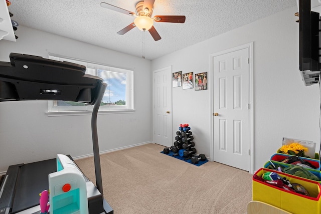 8534 Pebblebrook Dr, Frisco, TX 75034 - workout area featuring a textured ceiling, carpet flooring, and a ceiling fan