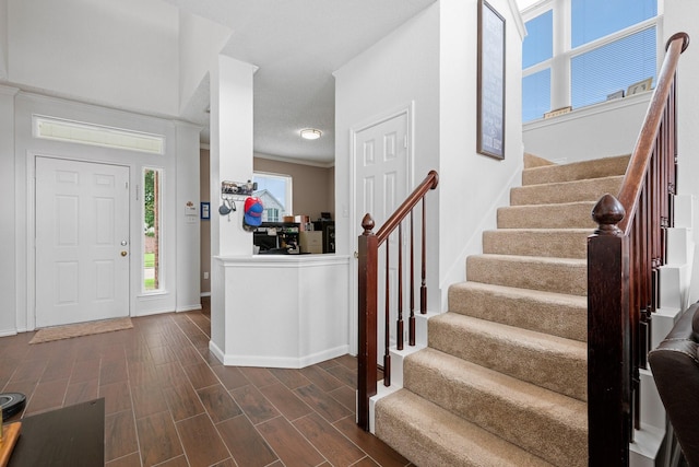 8534 Pebblebrook Dr, Frisco, TX 75034 - foyer with stairs and dark wood-type flooring