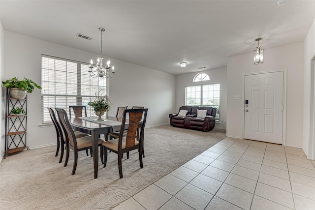 511 Poplar Vista Ln, Arlington, TX 76002 - dining area with a chandelier, light tile patterned floors, and light carpet