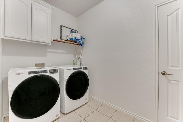 511 Poplar Vista Ln, Arlington, TX 76002 - laundry area with cabinet space, washer and dryer, and light tile patterned floors