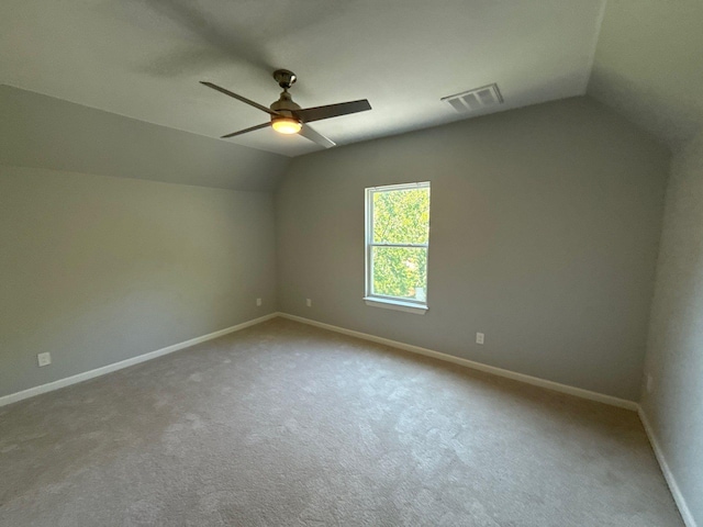 1510 W Woodard St, Denison, TX 75020 - empty room featuring vaulted ceiling, ceiling fan, and carpet floors