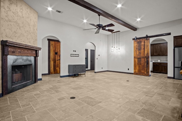101 Goldfinch Ln, Weatherford, TX 76088 - unfurnished living room featuring a ceiling fan, arched walkways, beamed ceiling, a fireplace, and recessed lighting