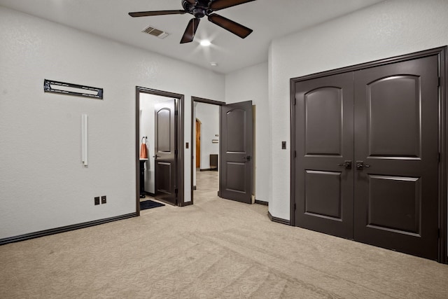 101 Goldfinch Ln, Weatherford, TX 76088 - unfurnished bedroom with light colored carpet, a closet, ceiling fan, and a textured wall