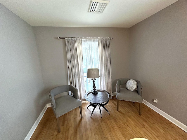 1325 W Chestnut St, Denison, TX 75020 - living area with baseboards and light wood-style floors