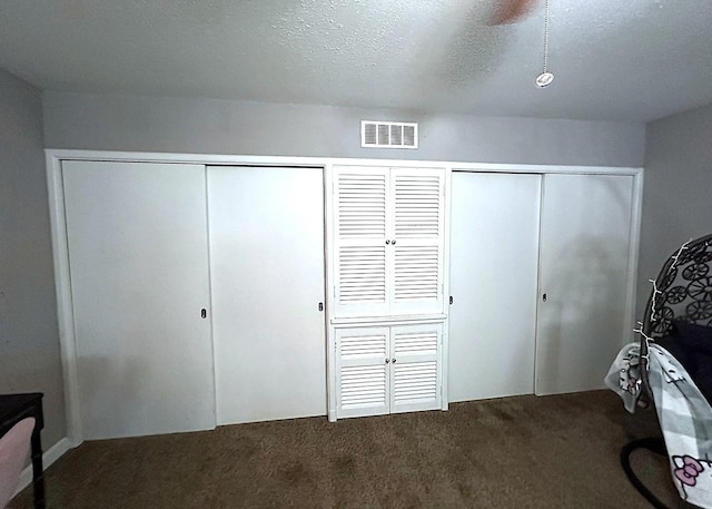 1325 W Chestnut St, Denison, TX 75020 - carpeted bedroom with a textured ceiling