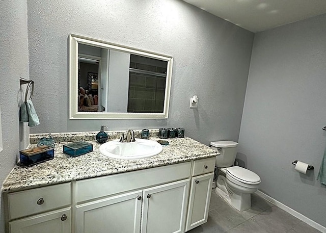 1325 W Chestnut St, Denison, TX 75020 - full bath with vanity and tile patterned floors