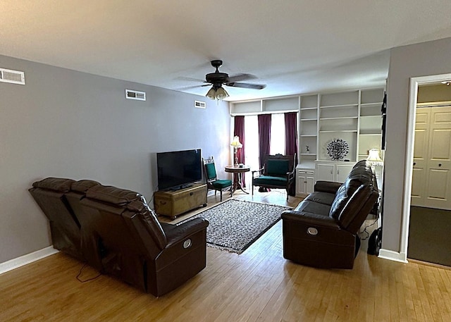 1325 W Chestnut St, Denison, TX 75020 - living area featuring a ceiling fan and wood-type flooring