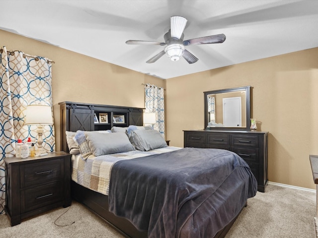 2012 Mobile Dr, Ennis, TX 75119 - bedroom with light colored carpet and ceiling fan