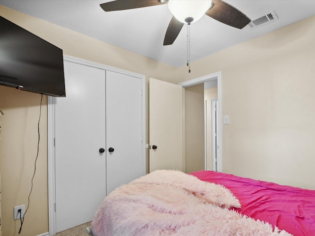 2012 Mobile Dr, Ennis, TX 75119 - bedroom featuring a closet, ceiling fan, and carpet flooring
