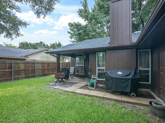 2012 Mobile Dr, Ennis, TX 75119 - back of house featuring a fenced backyard, a patio area, a chimney, and roof with shingles