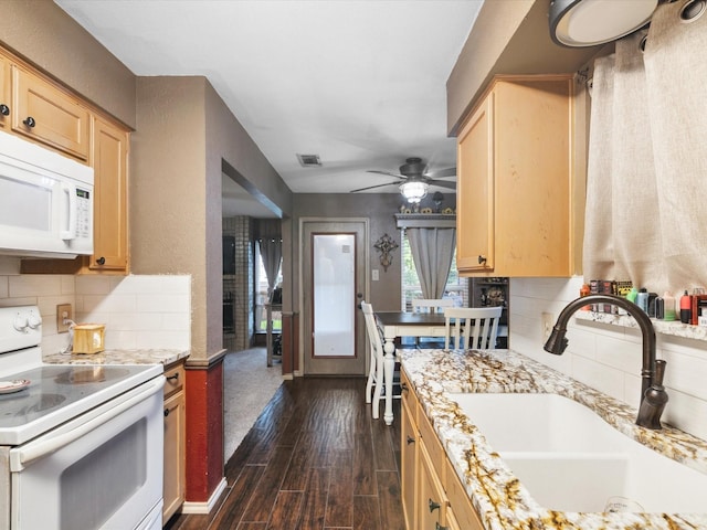 2012 Mobile Dr, Ennis, TX 75119 - kitchen with white appliances, light brown cabinetry, and decorative backsplash