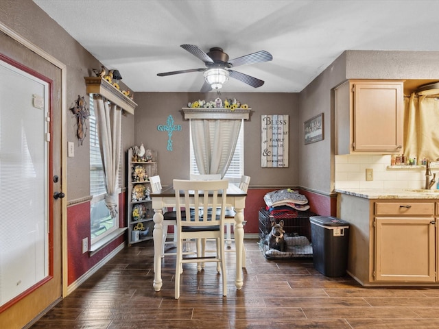 2012 Mobile Dr, Ennis, TX 75119 - dining room featuring ceiling fan and dark wood-style flooring