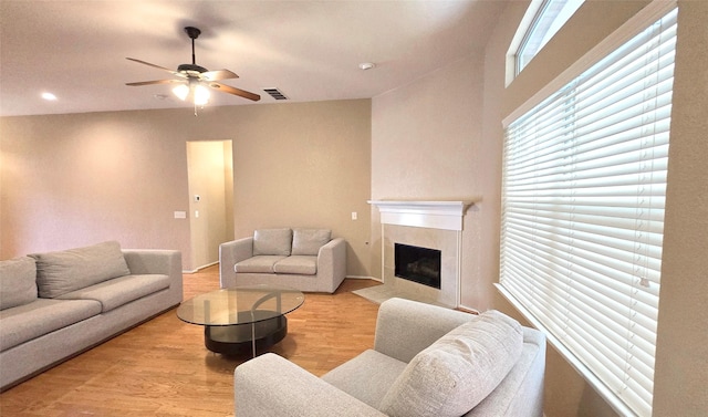 4012 Glenwyck Dr E, North Richland Hills, TX 76180 - living area with a ceiling fan, light wood finished floors, a tile fireplace, and recessed lighting