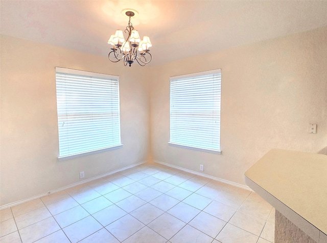 4012 Glenwyck Dr E, North Richland Hills, TX 76180 - unfurnished dining area featuring a chandelier, healthy amount of natural light, and light tile patterned floors