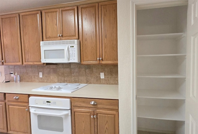 4012 Glenwyck Dr E, North Richland Hills, TX 76180 - kitchen with white appliances, decorative backsplash, and light countertops