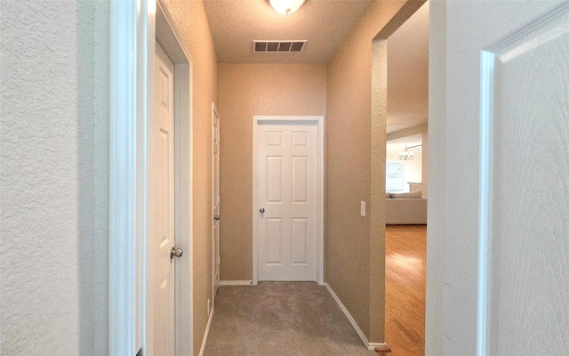 4012 Glenwyck Dr E, North Richland Hills, TX 76180 - hallway with a textured wall and carpet floors