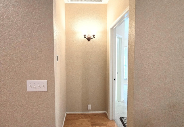 4012 Glenwyck Dr E, North Richland Hills, TX 76180 - hallway with wood finished floors and a textured wall