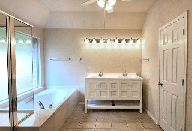 4012 Glenwyck Dr E, North Richland Hills, TX 76180 - bathroom with tile patterned flooring, a ceiling fan, a garden tub, double vanity, and vaulted ceiling