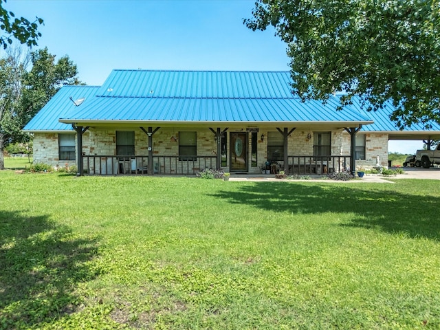 239 Valek Rd, Ennis, TX 75119 - view of front facade with stone siding, covered porch, and a standing seam roof