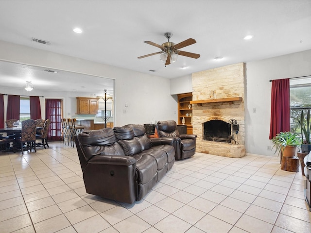 239 Valek Rd, Ennis, TX 75119 - living area featuring a ceiling fan, light tile patterned floors, recessed lighting, and a stone fireplace