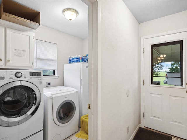 239 Valek Rd, Ennis, TX 75119 - laundry room featuring washing machine and clothes dryer and cabinet space