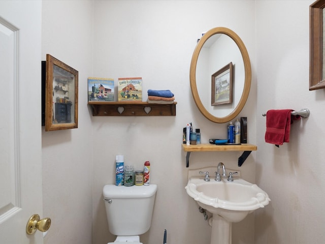 239 Valek Rd, Ennis, TX 75119 - half bathroom featuring toilet and a sink