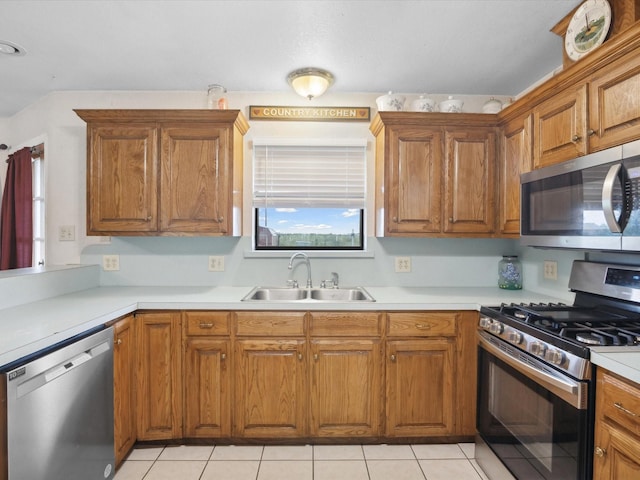 239 Valek Rd, Ennis, TX 75119 - kitchen featuring appliances with stainless steel finishes and brown cabinetry