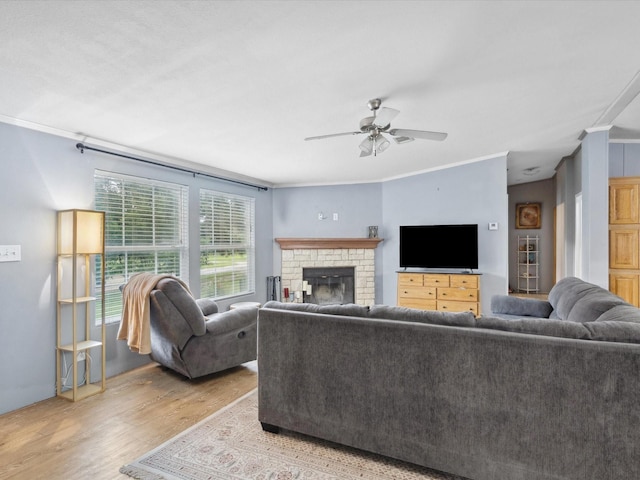 403 SE County Road 3048c, Corsicana, TX 75109 - living area featuring light wood finished floors, a ceiling fan, crown molding, and a fireplace