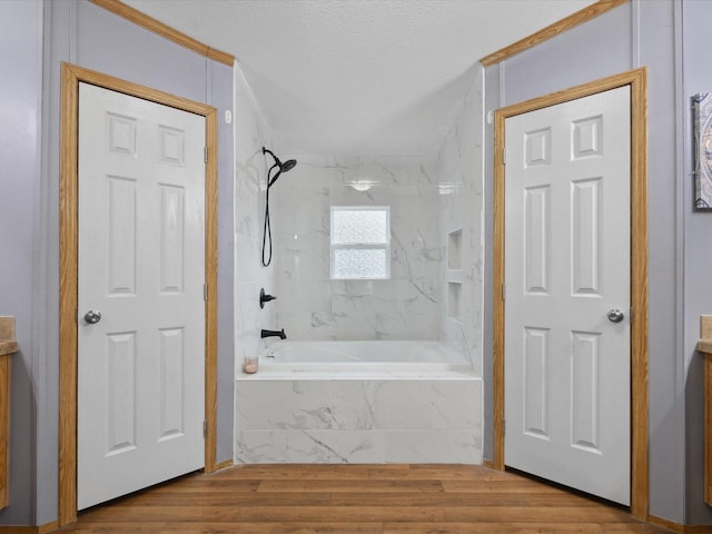 403 SE County Road 3048c, Corsicana, TX 75109 - full bath featuring a combined bath / shower with marble appearance, wood finished floors, a textured ceiling, and ornamental molding