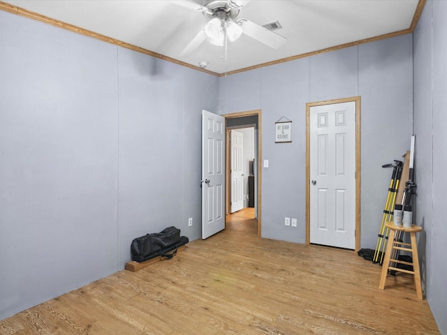 403 SE County Road 3048c, Corsicana, TX 75109 - unfurnished bedroom featuring crown molding, wood finished floors, and ceiling fan