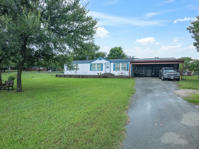 403 SE County Road 3048c, Corsicana, TX 75109 - manufactured / mobile home with driveway, a front yard, and a carport