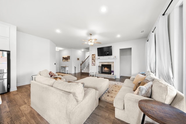 406 Garden Tree Trl, Midlothian, TX 76065 - living room featuring stairs, recessed lighting, a ceiling fan, dark wood-style floors, and a stone fireplace