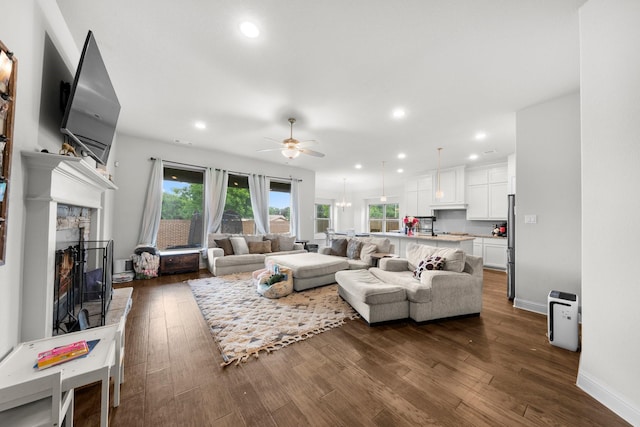 406 Garden Tree Trl, Midlothian, TX 76065 - living area with ceiling fan, a fireplace, recessed lighting, and dark wood-style flooring