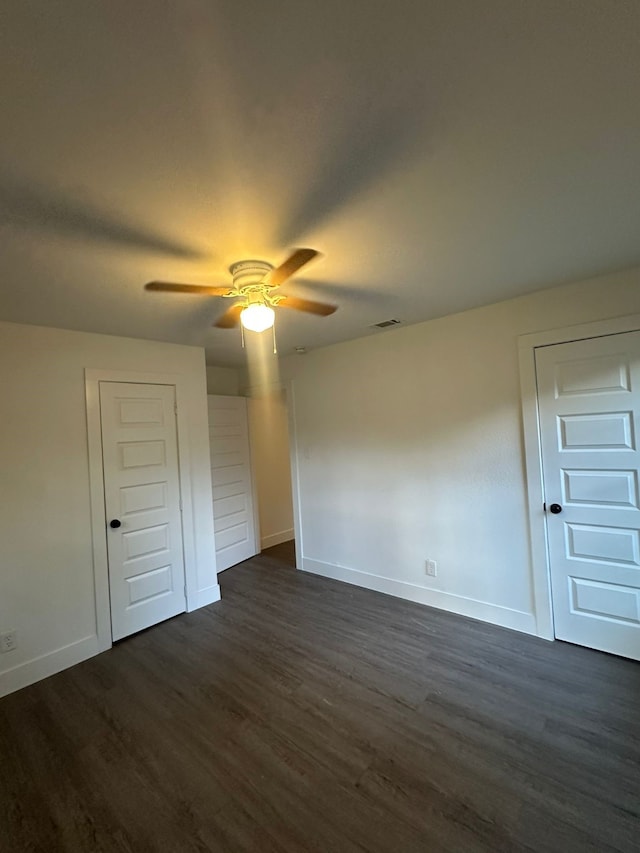 616 Leyenda Dr, Mesquite, TX 75149 - unfurnished bedroom featuring dark wood-style flooring and ceiling fan