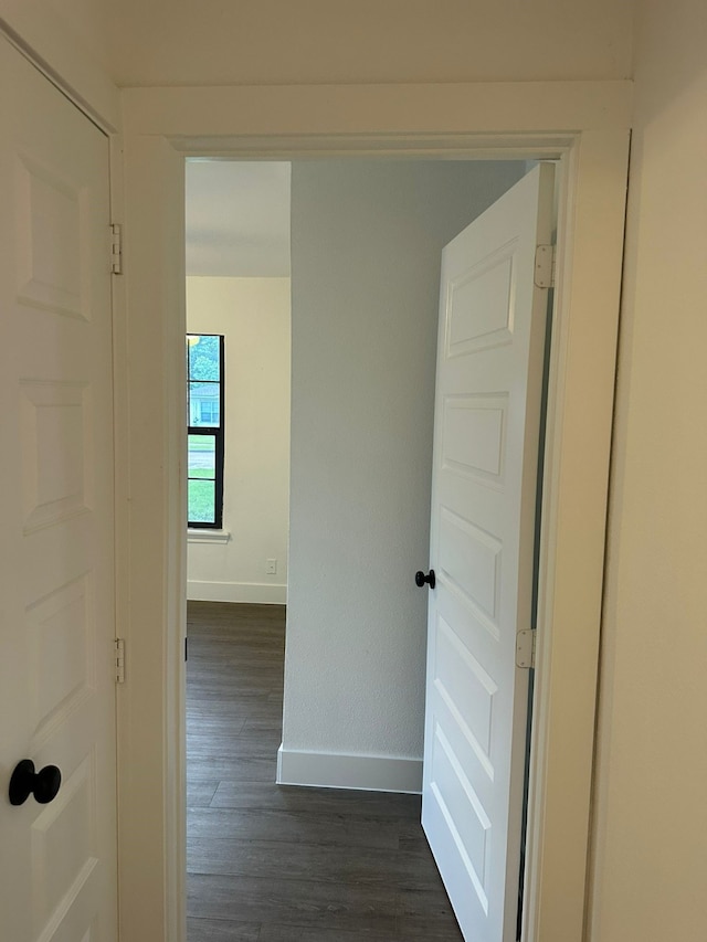 616 Leyenda Dr, Mesquite, TX 75149 - hall with baseboards and dark wood-type flooring