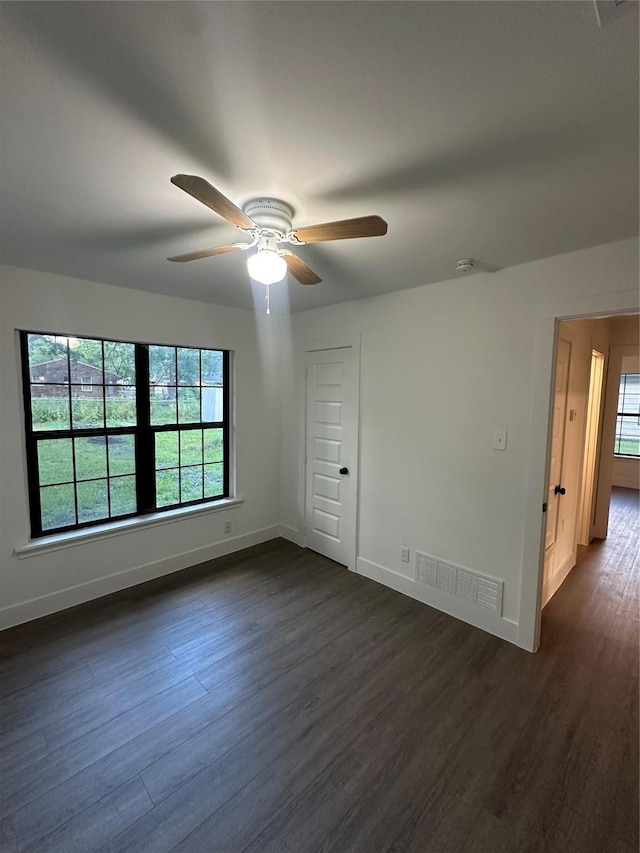 616 Leyenda Dr, Mesquite, TX 75149 - spare room with dark wood-style floors and ceiling fan