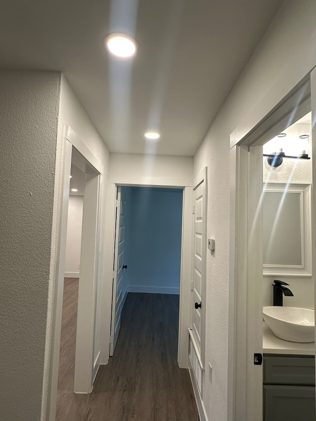 616 Leyenda Dr, Mesquite, TX 75149 - hallway featuring dark wood finished floors and a textured wall