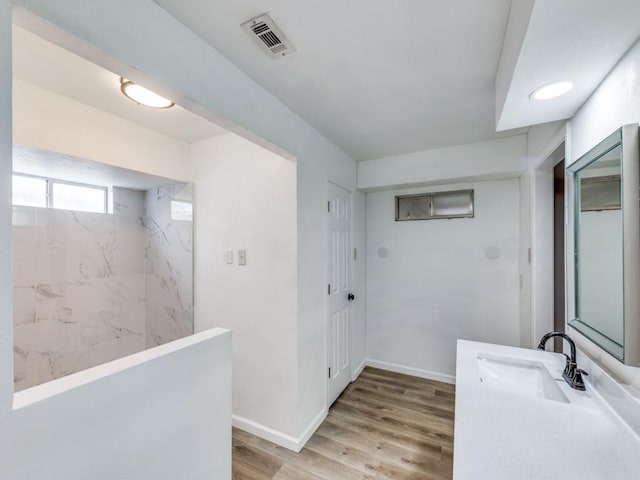 810 Serenade Ln, Richardson, TX 75081 - full bathroom featuring vanity, wood finished floors, and a shower