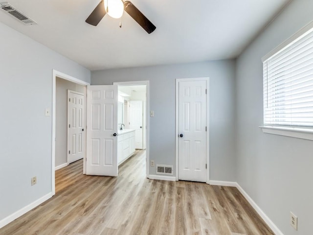 810 Serenade Ln, Richardson, TX 75081 - unfurnished bedroom featuring light wood-style flooring and a ceiling fan