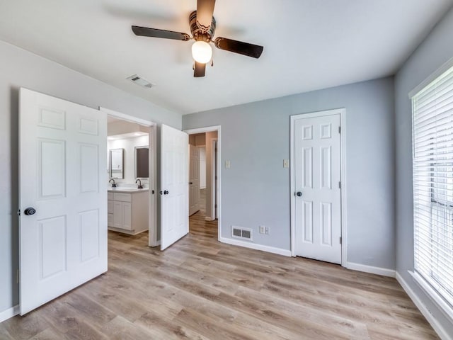810 Serenade Ln, Richardson, TX 75081 - unfurnished bedroom with light wood-type flooring, ceiling fan, ensuite bathroom, and a closet