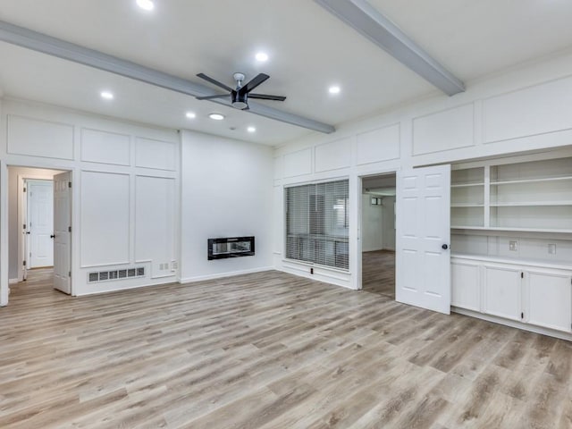 810 Serenade Ln, Richardson, TX 75081 - unfurnished living room with ceiling fan, heating unit, beamed ceiling, light wood finished floors, and recessed lighting