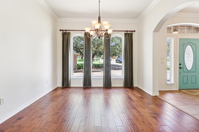 8502 Linden Ct, Granbury, TX 76049 - entryway with arched walkways, a chandelier, wood-type flooring, and crown molding