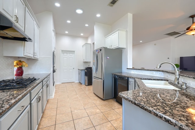 2860 Prado, Grand Prairie, TX 75054 - kitchen with black appliances, extractor fan, dark stone counters, light tile patterned floors, and recessed lighting