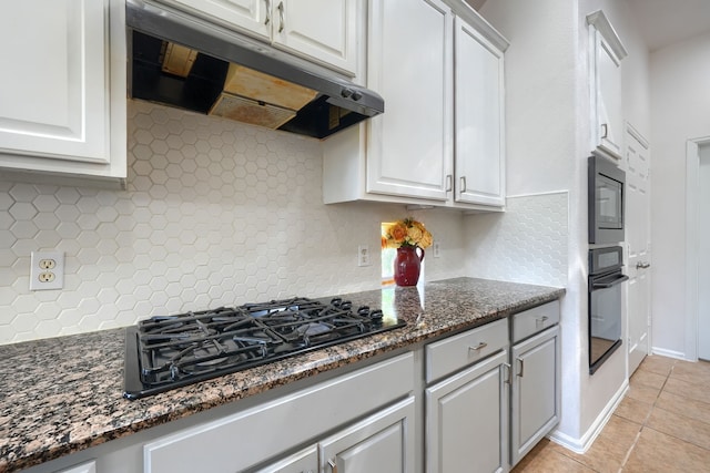 2860 Prado, Grand Prairie, TX 75054 - kitchen with under cabinet range hood, black appliances, decorative backsplash, and white cabinetry