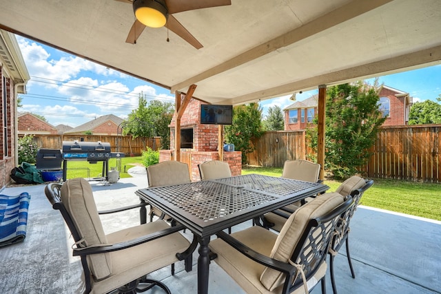 2860 Prado, Grand Prairie, TX 75054 - fenced backyard featuring outdoor dining space, a patio area, ceiling fan, and a brick fireplace