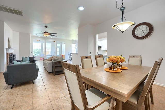 2860 Prado, Grand Prairie, TX 75054 - dining space with light tile patterned floors, recessed lighting, a ceiling fan, and a fireplace
